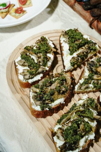 close up of the green harissa, mushroom and ricotta cristini